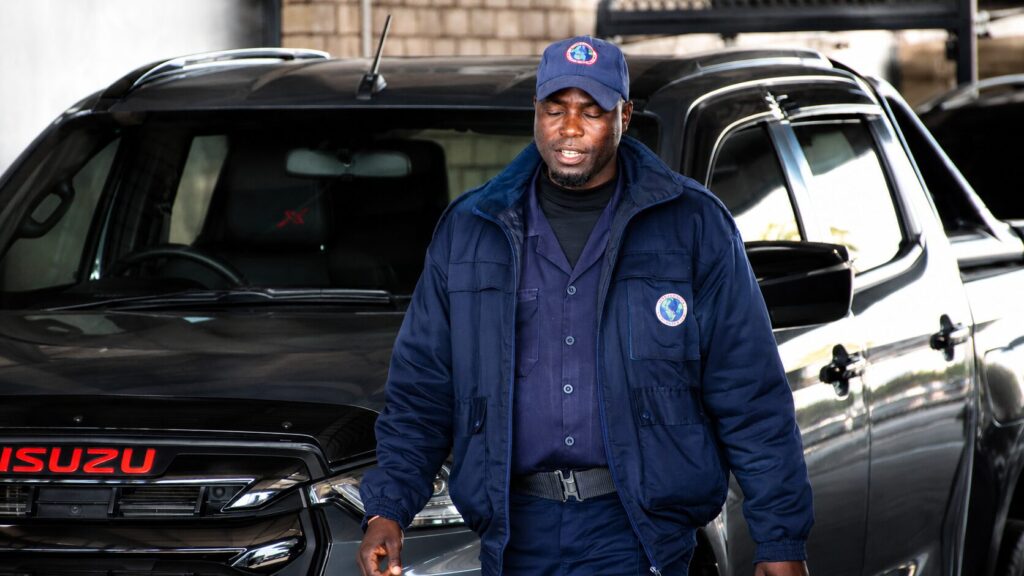 Male Global Elite security officer in navy uniform and cap