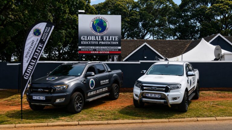 Branded Global Elite Executive Protection vehicles parked outside company head office