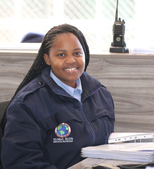 Female Global Elite security officer in navy uniform